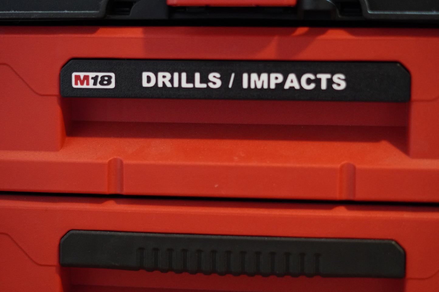 Close-up of M18 labeled handle on toolbox drawer