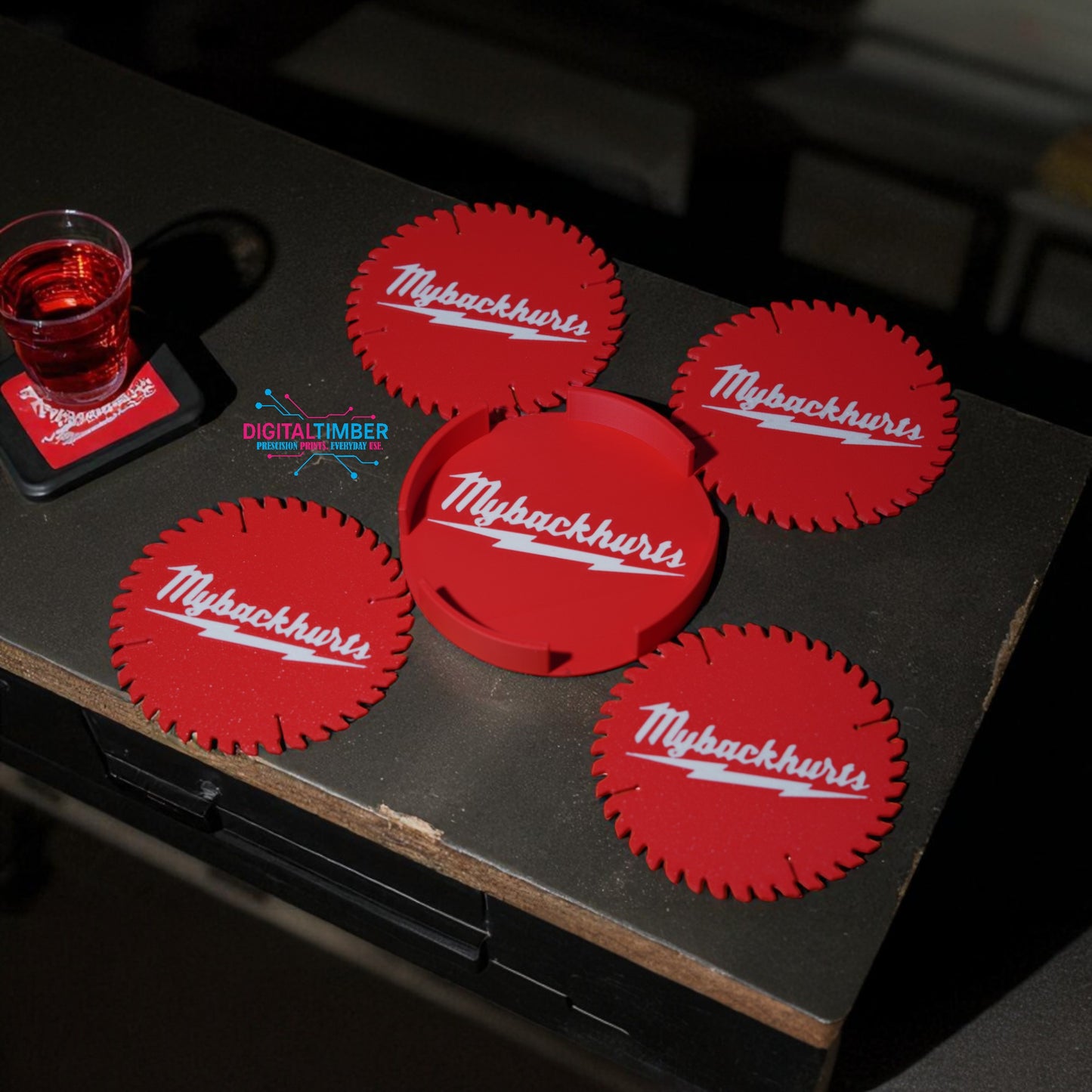 Red coasters with 'Mybackhurts' logo on a dark surface