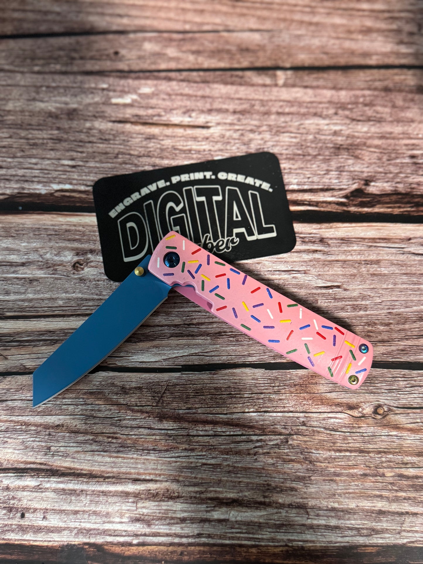 Sprinkle Donut Folding Knife shown open and closed with colorful sprinkle design and blue blade