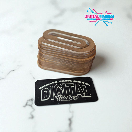Stack of engraved wooden coasters with 'Digital Timber' branding on a marble surface.