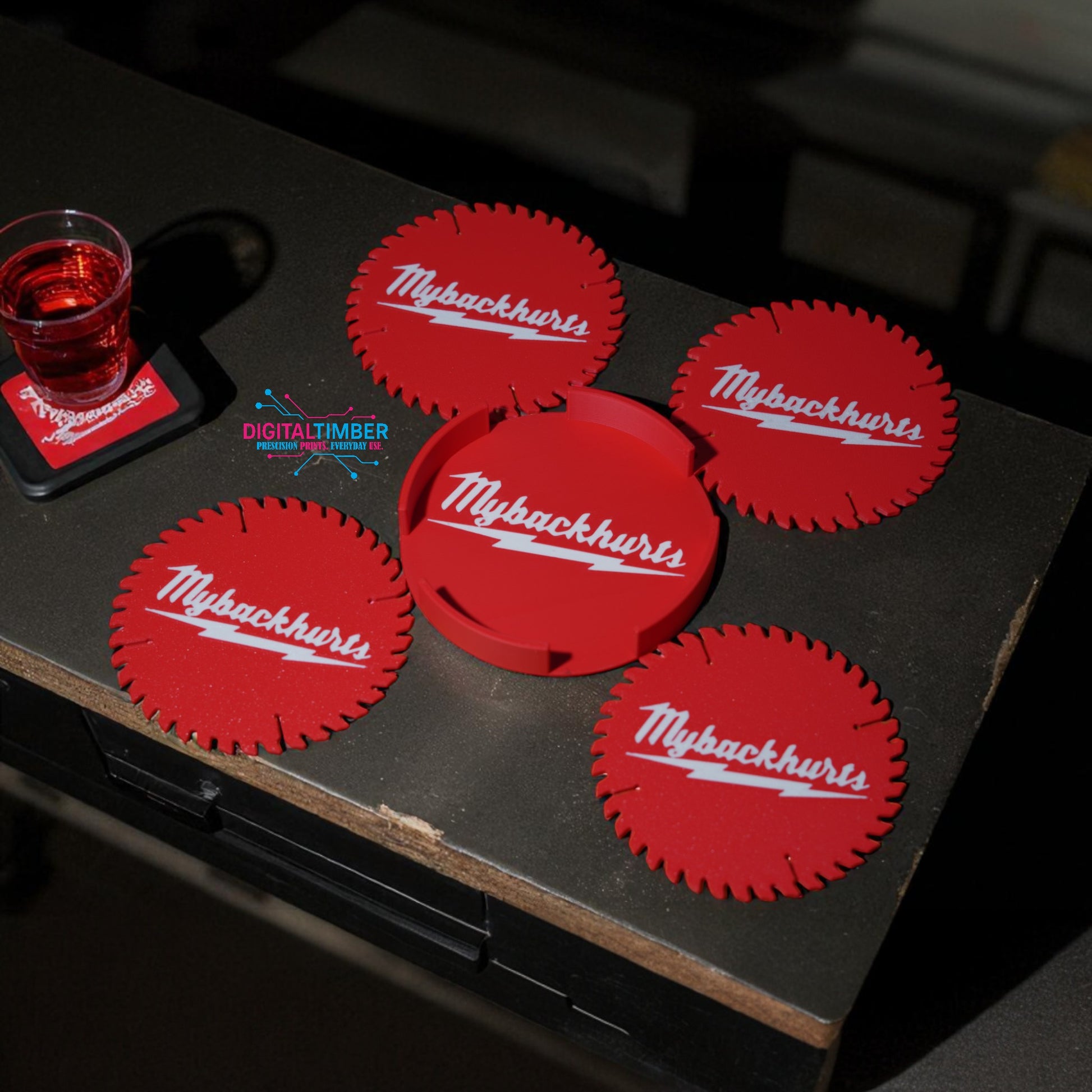 Red coasters with 'Mybackhurts' logo on a dark surface